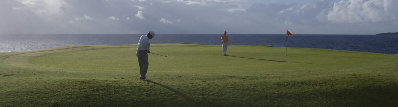 Golfers playing in the sun