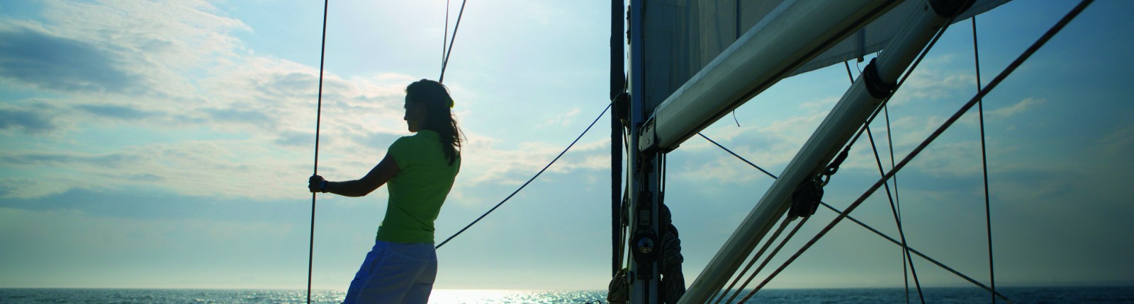 Woman standing on sailing boat