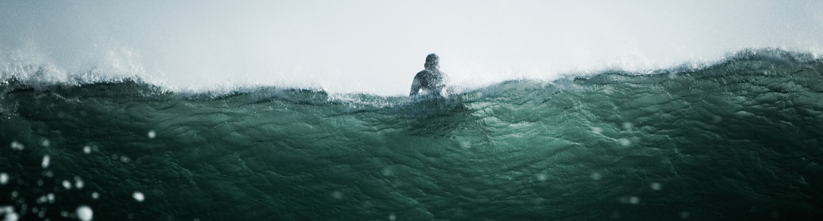 Surfer on a wave in the sea