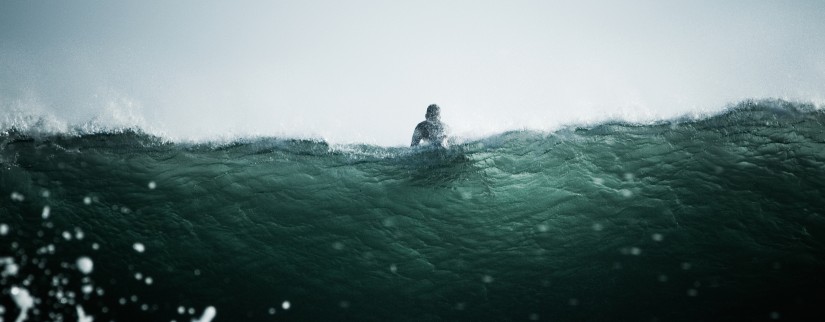 Surfer on a wave in the sea